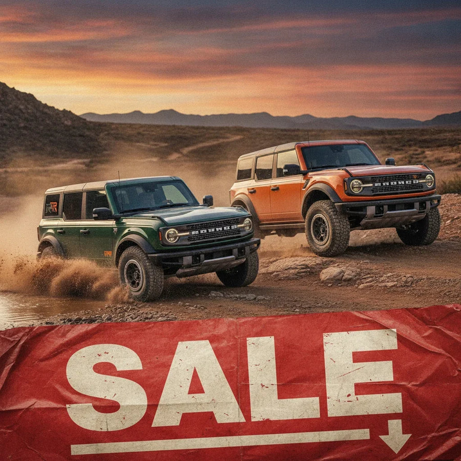 Editorial photo-realistic HERO image for automotive news (2026-10-06). Feature Ford vehicles specifically 2027 Bronco RTR, Bronco Raptor. Scene: A dra